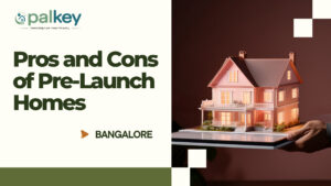 A miniature, illuminated pink model house being presented on a tablet, illustrating a pre-launch property. The text overlay reads: "Pros and Cons of Pre-Launch Homes Bangalore."