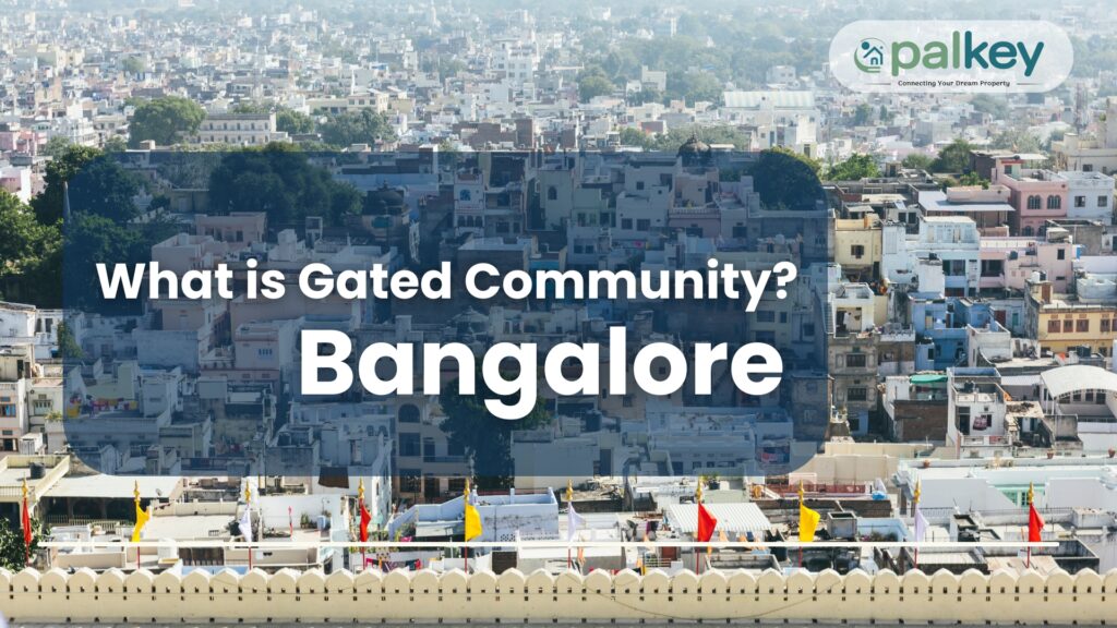 A high-angle view of a densely packed, multi-colored urban cityscape in Bangalore. Overlay text asks: "What is Gated Community? Bangalore," with the OpalKey logo in the top right corner.