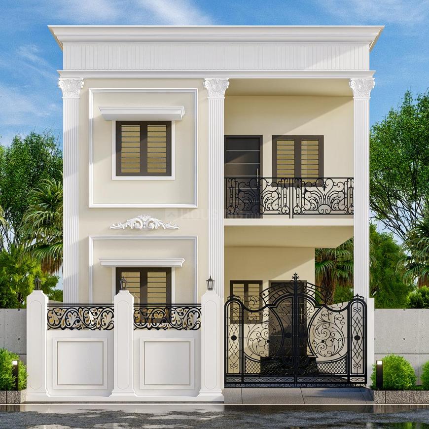 1000015203 A modern two-story house with a cream exterior, white pillars, decorative black wrought iron balcony railings, and a large ornate black gate, set against a blue sky with green trees.