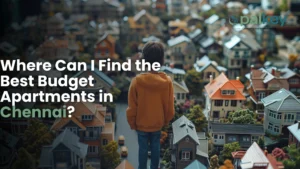 A promotional graphic for "Opalkey" with the question "Where Can I Find the Best Budget Apartments in Chennai?". The image features a young person standing in a miniature model town of densely packed, colorful houses, symbolizing a search for a home in a large city.