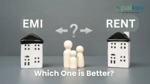 A graphic contrasting EMI (Equated Monthly Installment for a home loan) and Rent, with two miniature ceramic houses and a small wooden family figure in the middle. The text asks: "Which One is Better?"