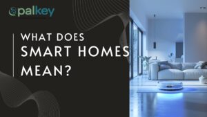 A promotional graphic for "opalkey" with the question "WHAT DOES SMART HOMES MEAN?". The image features a modern, clean living room with a couch, a large window, and a robotic vacuum cleaner operating on the floor. The background is a mix of gray and white. The "opalkey" logo is in the top left corner.