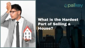A promotional graphic for "opalkey" with the question "What is the Hardest Part of Selling a House?". The image features a man in a blazer holding his head in frustration with a small model of a house in his other hand. The background is a dark cityscape at night. The "opalkey" logo is in the top left corner.