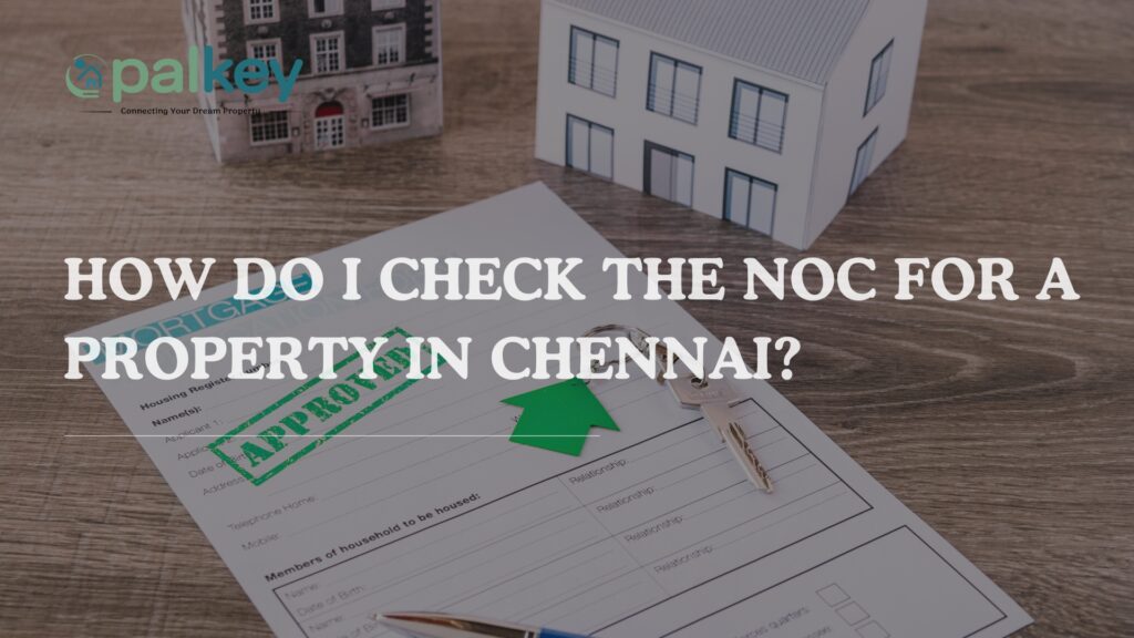 A promotional graphic for a real estate service with the question, "HOW DO I CHECK THE NOC FOR A PROPERTY IN CHENNAI?". The image shows a mortgage loan application form with a large green "APPROVED" stamp, along with a house model, keys, and a calculator. The background is a white table with two miniature house models. The Opalkey logo is in the top left corner.