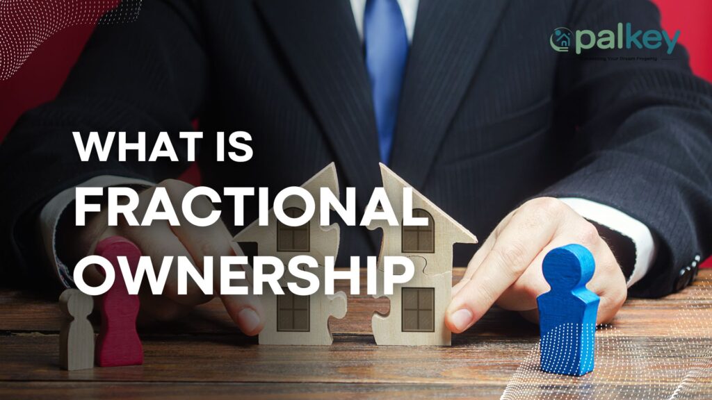 A promotional graphic for "Opalkey" with the question "WHAT IS FRACTIONAL OWNERSHIP?". The image features a business professional's hands joining two puzzle pieces that form a miniature house. Two distinct colored wooden figurines (red and blue) stand on the table, symbolizing co-owners.