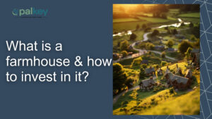 A digital image with a dark blue background and the title "What is a farmhouse & how to invest in it?" on the left, next to a photo of a sunny, picturesque village of small farmhouses nestled in rolling green hills with winding paths and trees.
